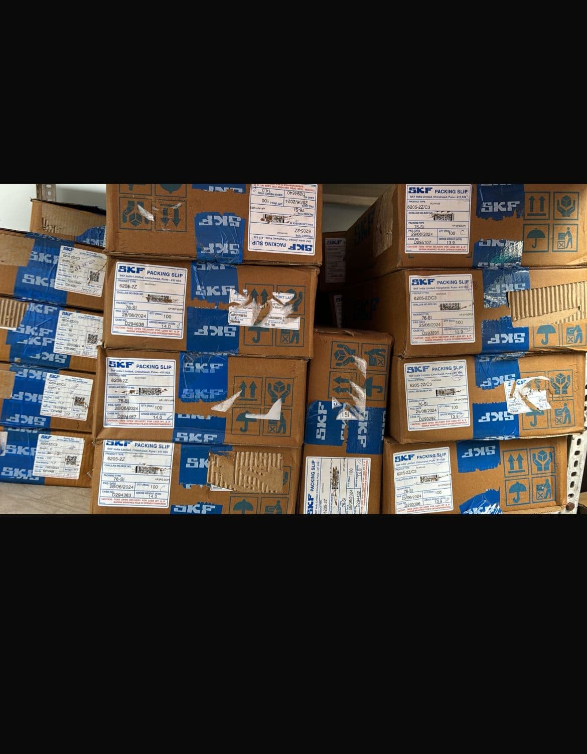 Stack of genuine SKF 6205-2Z deep groove ball bearing boxes in stock