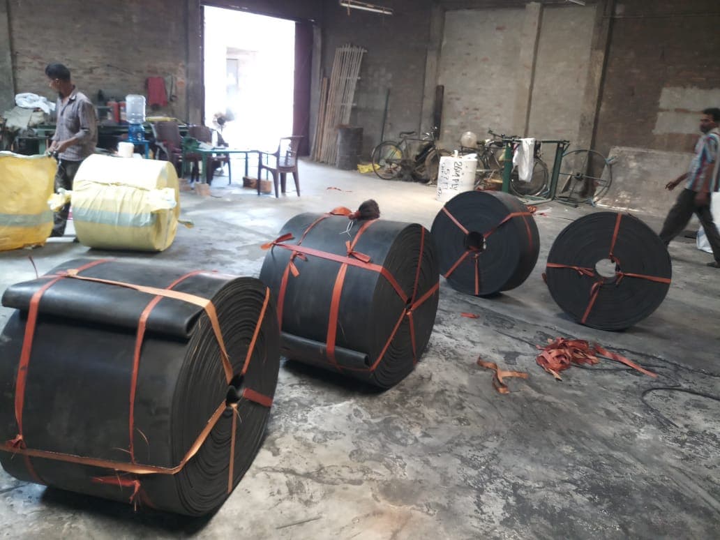 Conveyor belt rolls in a manufacturing plant